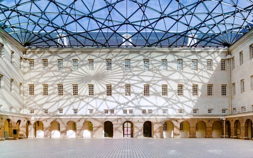 Skylight casting shadows inside The Maritime Museum courtyard, Amsterdam.