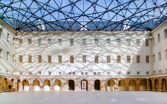 Skylight casting shadows inside The Maritime Museum courtyard, Amsterdam.