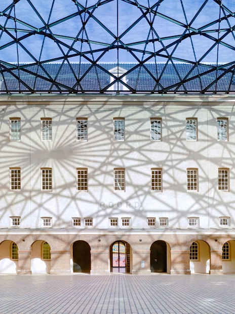 Skylight casting shadows inside The Maritime Museum courtyard, Amsterdam.