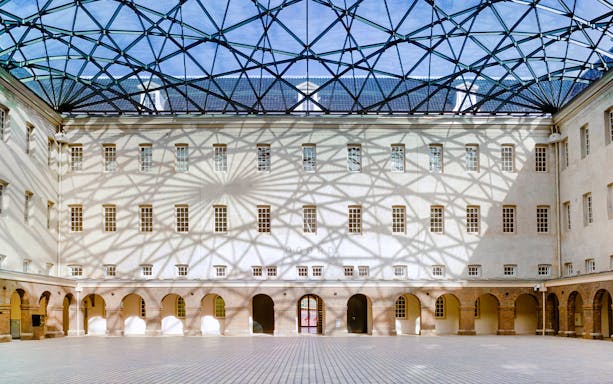 Skylight casting shadows inside The Maritime Museum courtyard, Amsterdam.