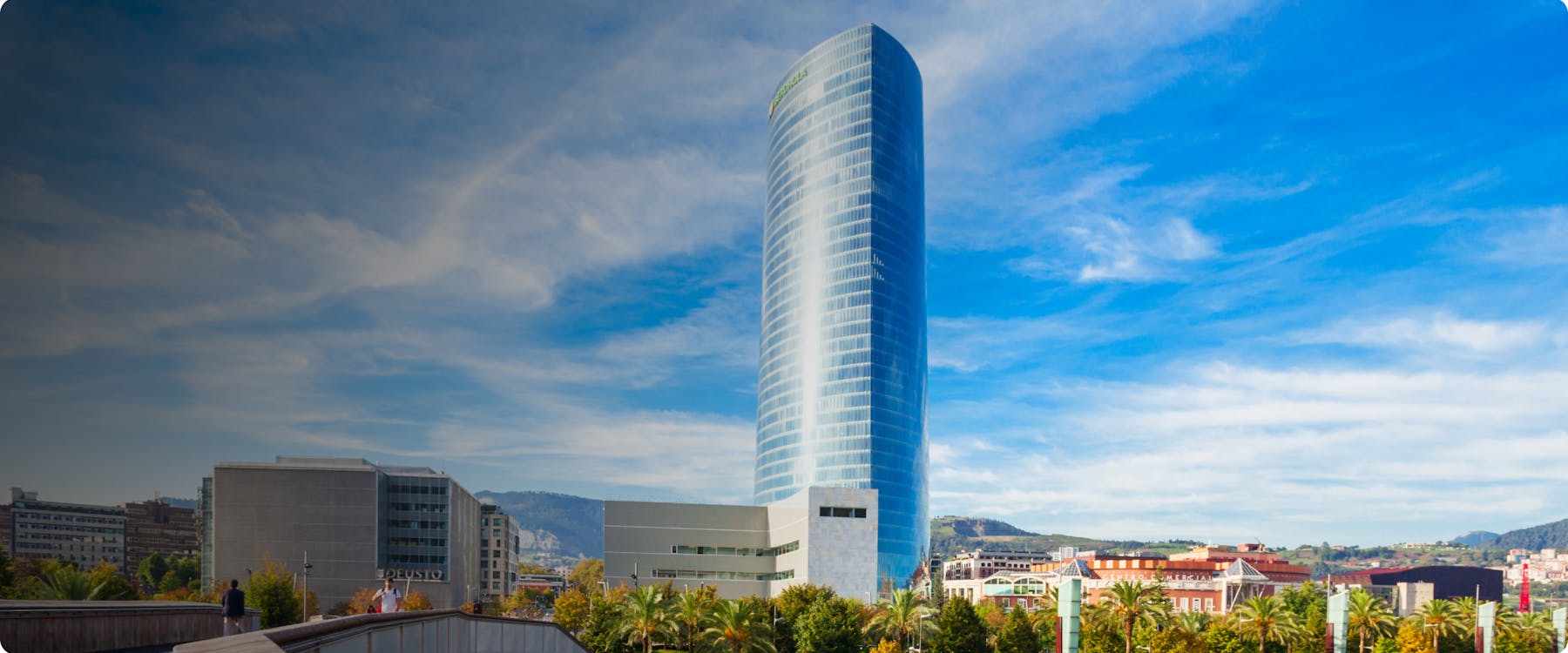Bilbao's Iberdrola Tower against a blue sky.