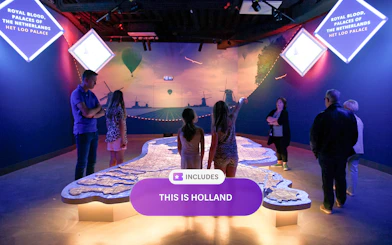 Visitors exploring interactive map at This Is Holland in Amsterdam.