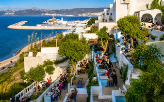 Terrace seating at Cafe Hafa overlooking the sea in Tangier, Morocco.