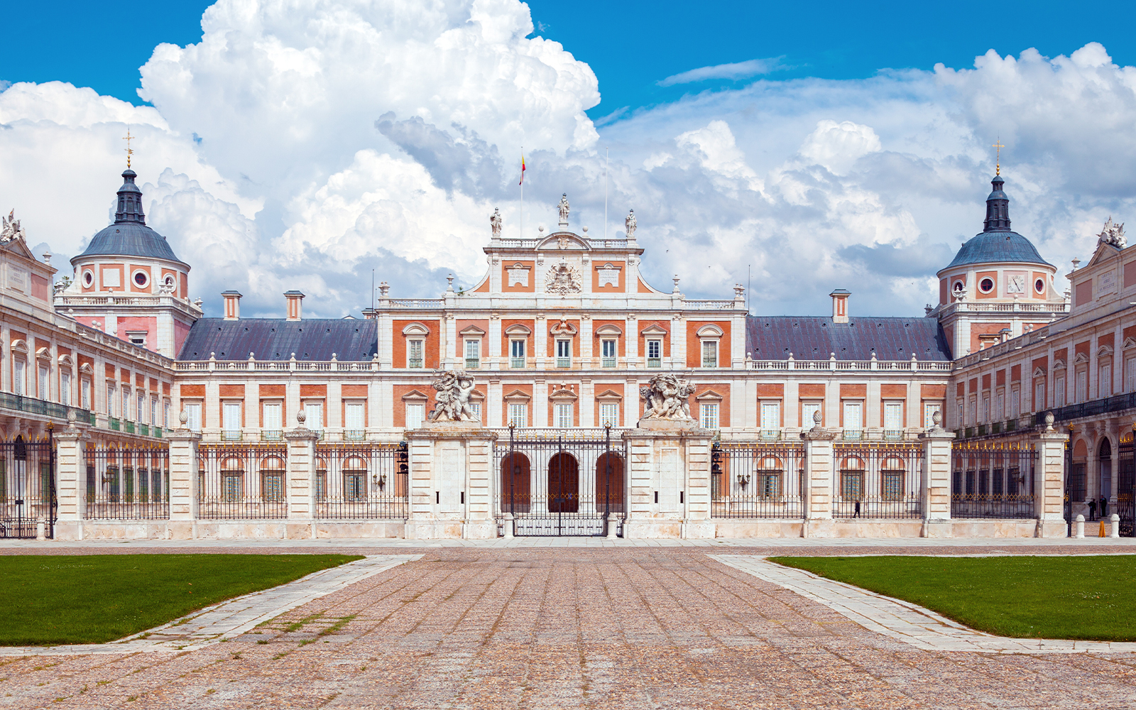 Royal Palace of Aranjuez facade with blue sky, Madrid, Spain.