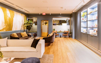 Luxurious lounge area at Top of the Rock Observation Deck with modern decor and seating.
