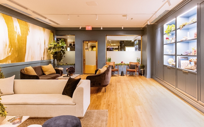 Luxurious lounge area at Top of the Rock Observation Deck with modern decor and seating.