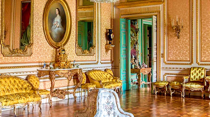 Elegant room in Musei Reali, Turin, featuring ornate chandelier and antique furniture.