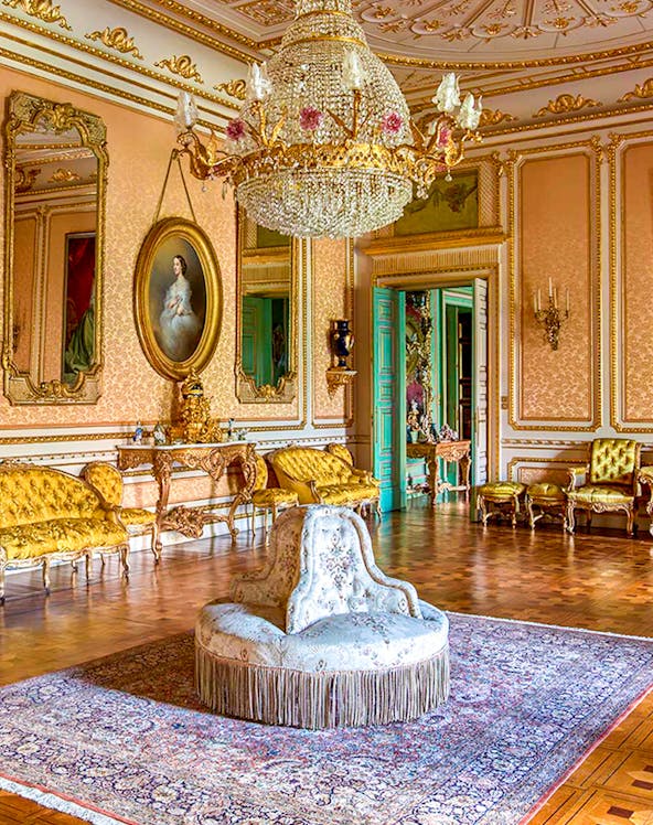 Elegant room in Musei Reali, Turin, featuring ornate chandelier and antique furniture.