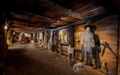 Hallstatt Salt Mine exhibit with historical figures and tools, Salzburg tour.