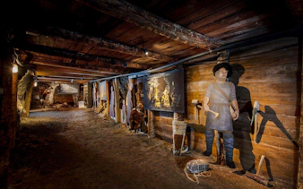 Hallstatt Salt Mine exhibit with historical figures and tools, Salzburg tour.