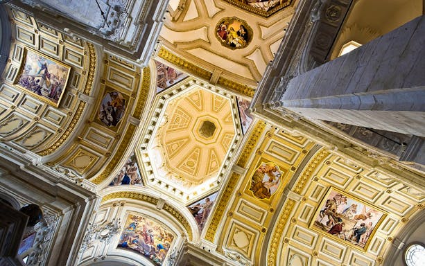 Ceiling frescoes in Cagliari's historic center during guided tour.