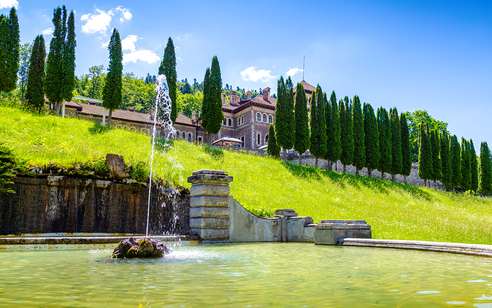 Fountain and garden at Cantacuzino Castle, Busteni, Prahova, Romania.