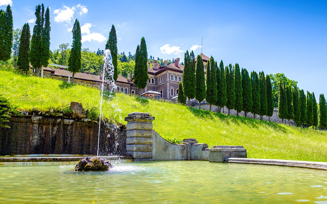 Fountain and garden at Cantacuzino Castle, Busteni, Prahova, Romania.