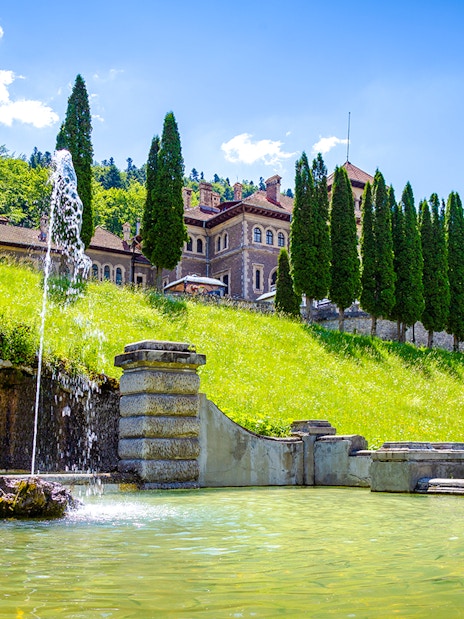 Fountain and garden at Cantacuzino Castle, Busteni, Prahova, Romania.