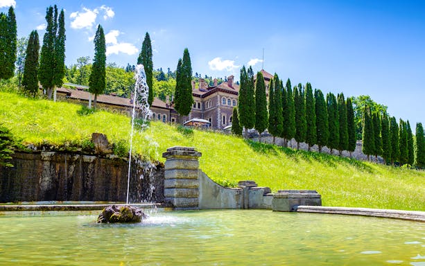 Fountain and garden at Cantacuzino Castle, Busteni, Prahova, Romania.