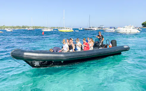 Tourists on a boat tour in Cannes, enjoying views of Antibes and Îles de Lérins.