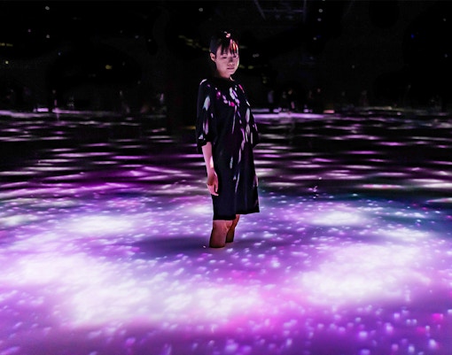 teamLab Planets Tokyo immersive art installation with mirrored floors and digital light displays