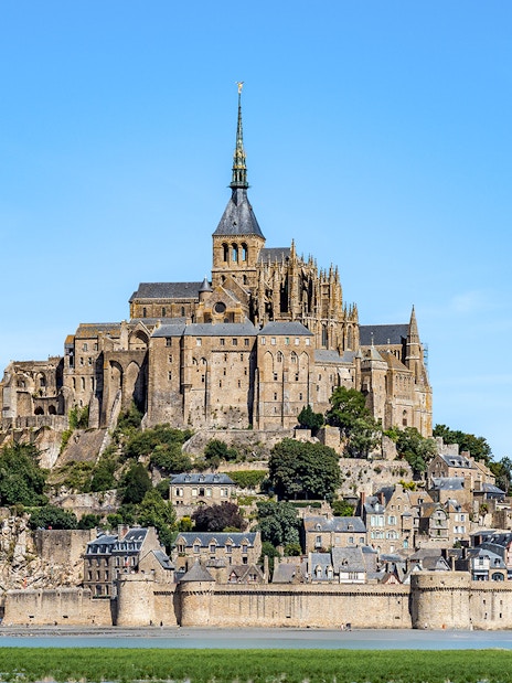 Mont St. Michel abbey and village on tidal island, Normandy, France.