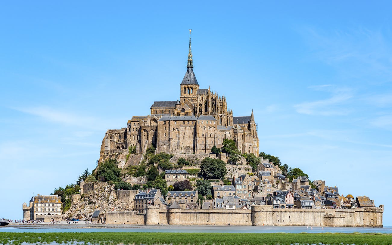 Mont St. Michel abbey and village on tidal island, Normandy, France.