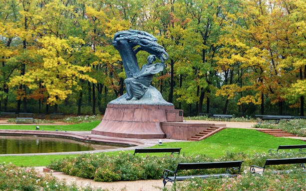 Chopin Monument in Warsaw's Łazienki Park during autumn.