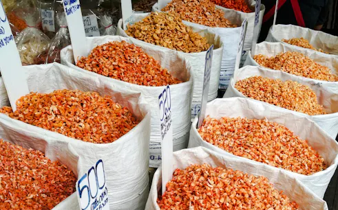 Bags of dried shrimp displayed at a market stall in Bangkok's Chinatown.