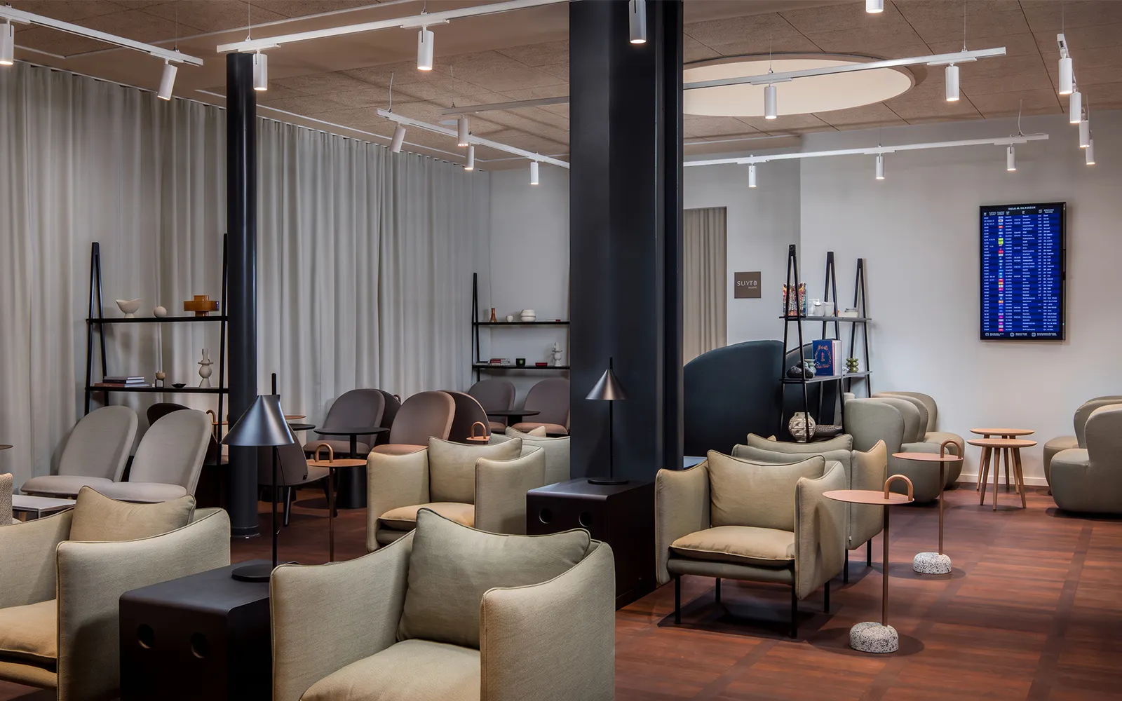 Aspire Lounge seating area with modern chairs and tables at Copenhagen Kastrup Airport Terminal 2.