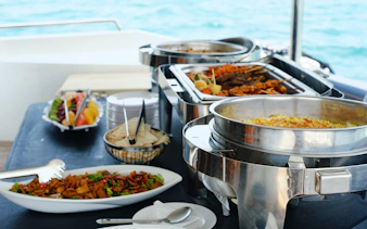Buffet lunch setup on Princes' Islands cruise with sea view in the background.