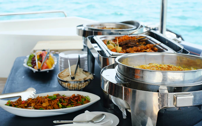 Buffet lunch setup on Princes' Islands cruise with sea view in the background.