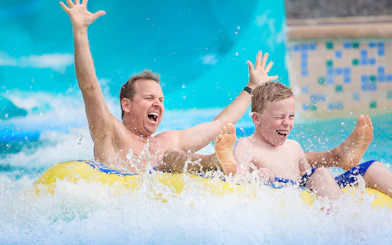 Customers enjoying water slide at Aqualand in Albufeira.