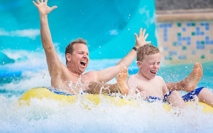 Customers enjoying water slide at Aqualand in Albufeira.