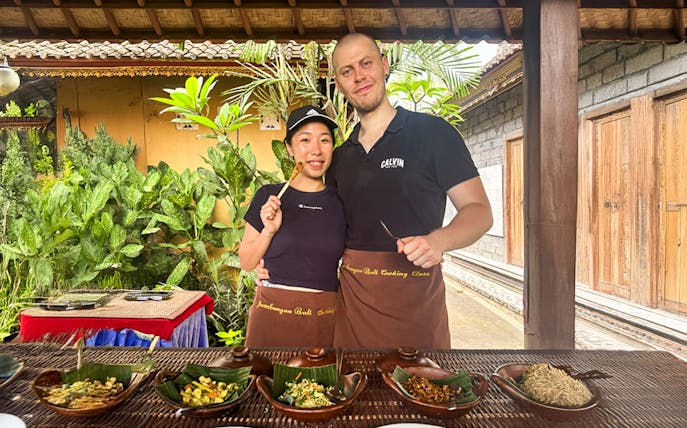 Participants enjoying Jambangan Bali Cooking Class in Ubud with traditional dishes.