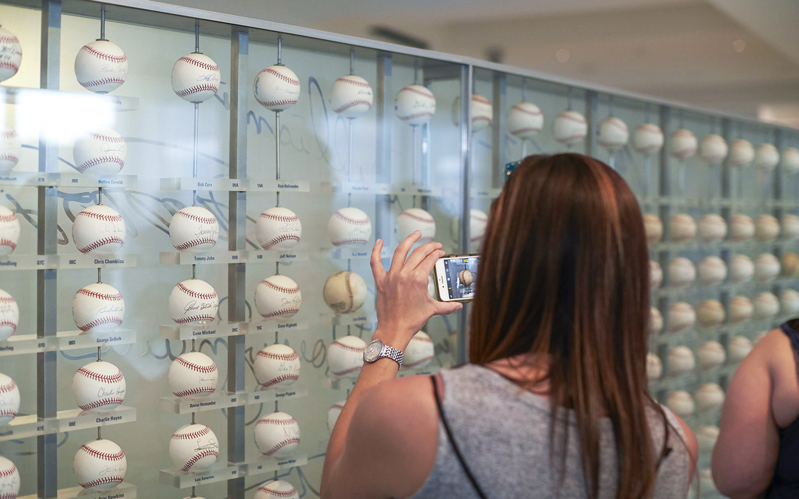 Baseball memorabilia display at Yankees Stadium tour.