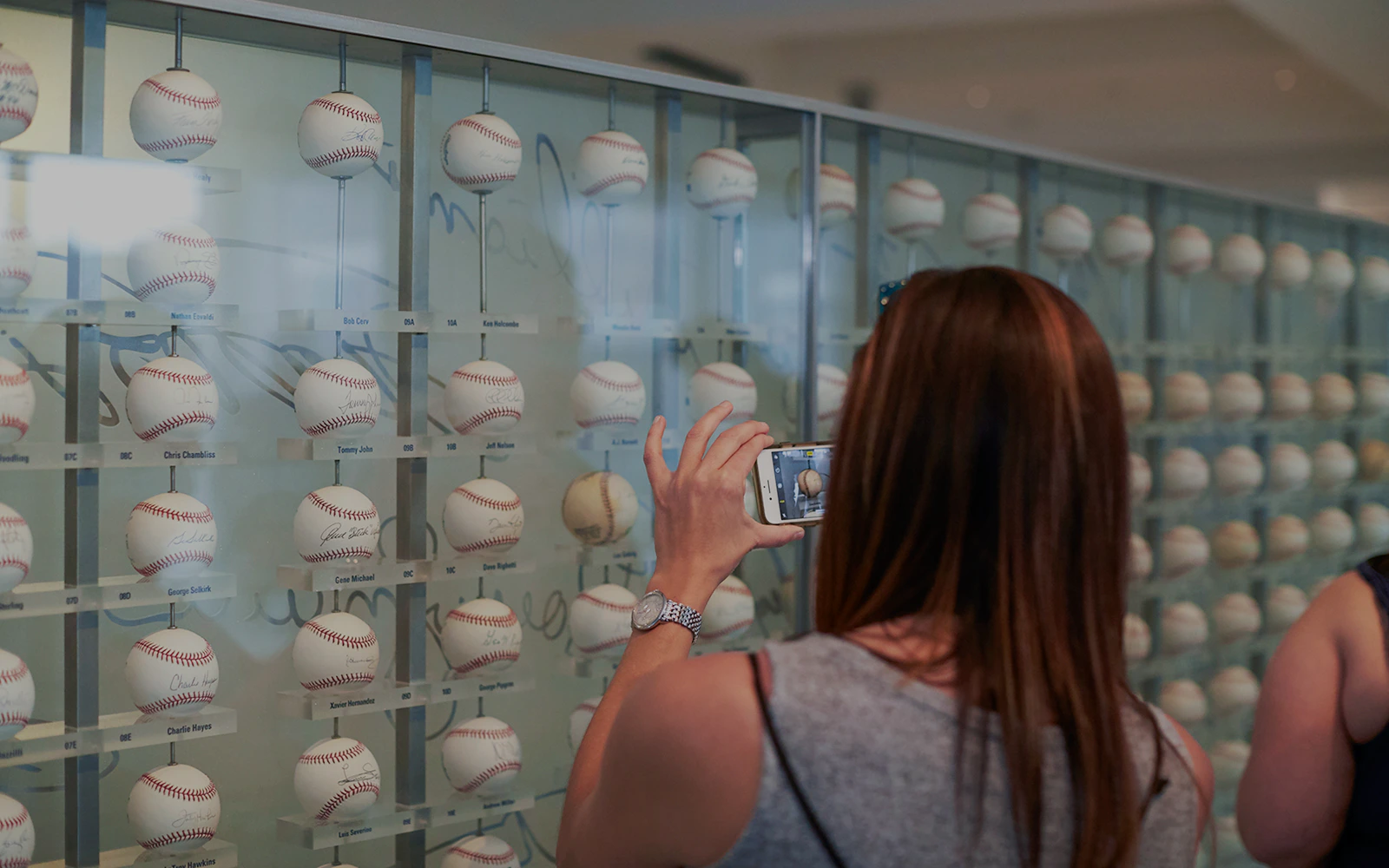 Baseball memorabilia display at Yankees Stadium tour.
