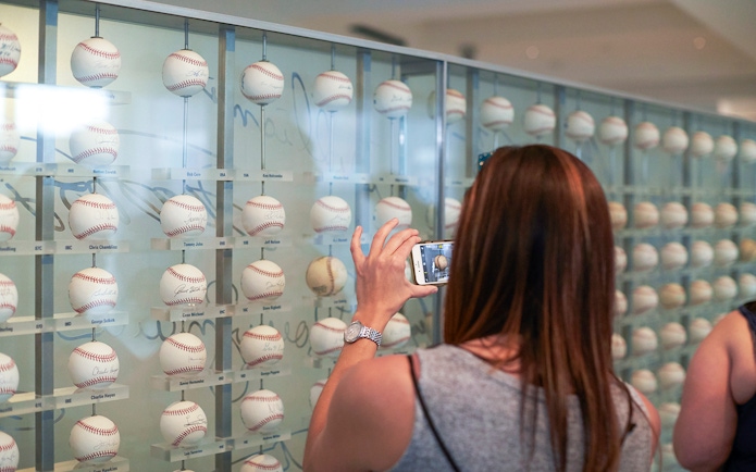 Baseball memorabilia display at Yankees Stadium tour.