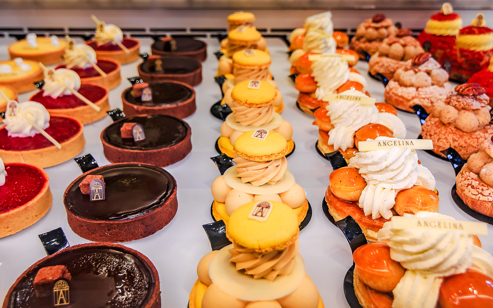 Bakery sweets display in Rue de Rivoli, featuring tarts and pastries from Angelina.