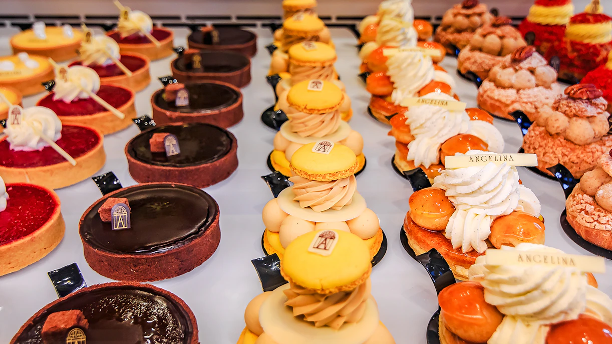 Bakery sweets display in Rue de Rivoli, featuring tarts and pastries from Angelina.