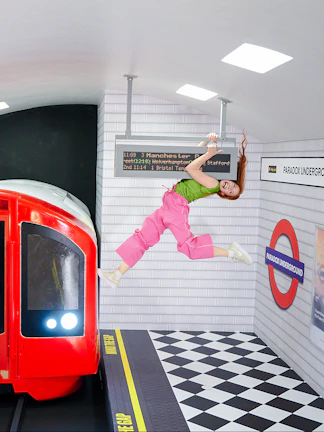 Guest hanging from a sign in a tilted subway illusion at Paradox Museum London.