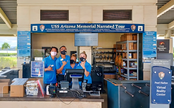 USS Arizona Memorial tour staff at Pearl Harbor visitor center.