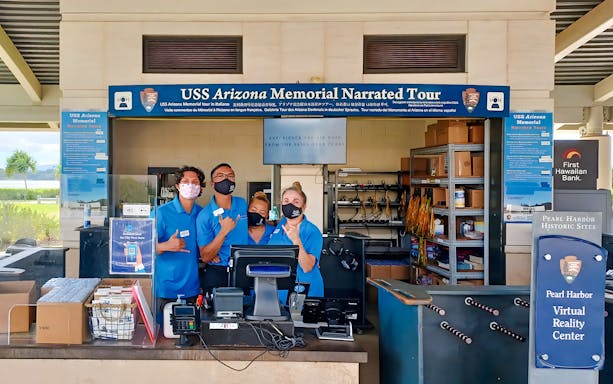 USS Arizona Memorial tour staff at Pearl Harbor visitor center.