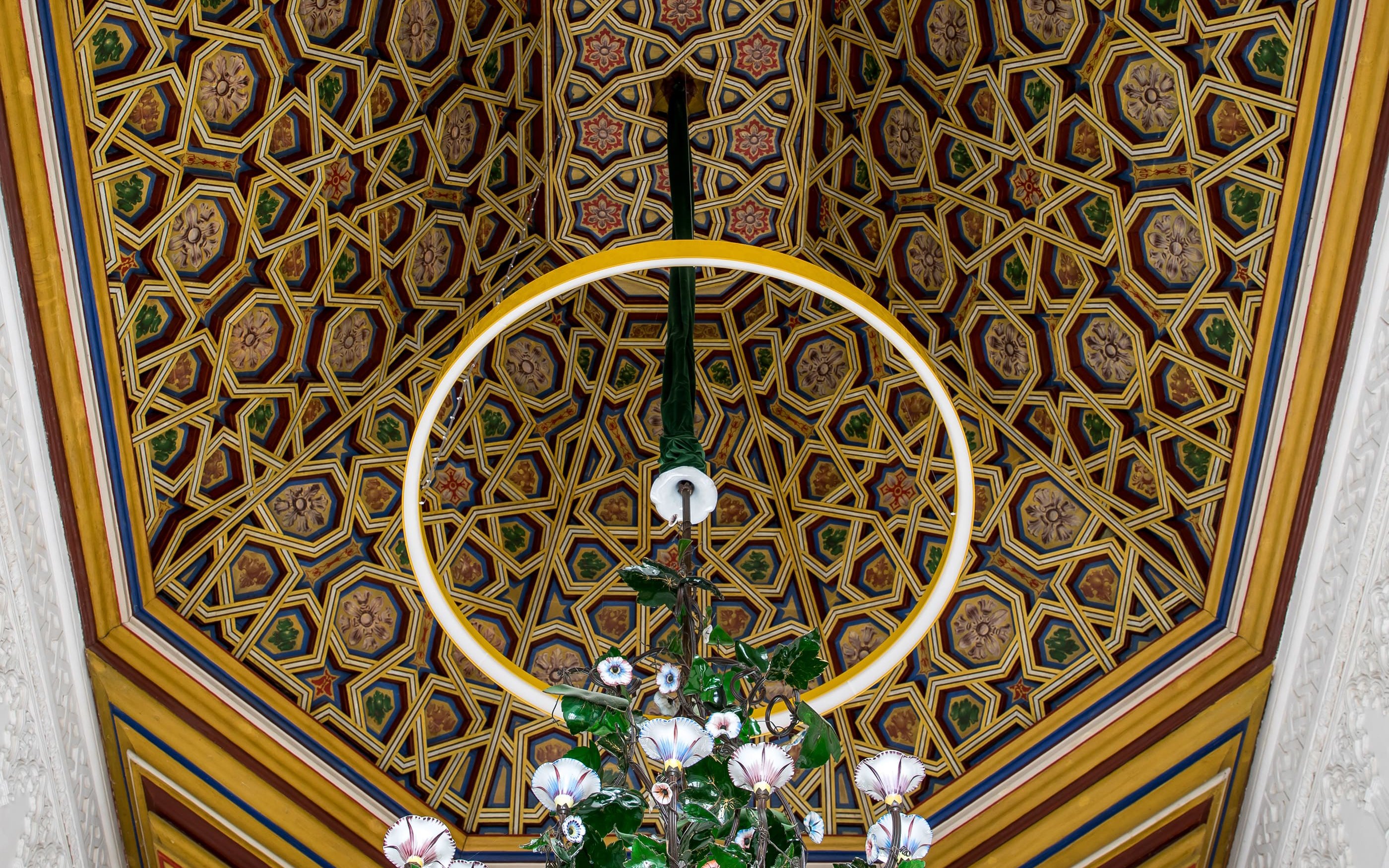 Ceiling decoration with intricate geometric patterns at Pena Palace, Sintra.