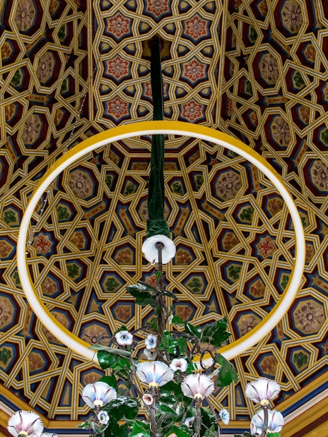 Ceiling decoration with intricate geometric patterns at Pena Palace, Sintra.