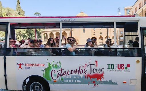 Tourists on a catacombs tour bus near Vatican Museums, Rome.