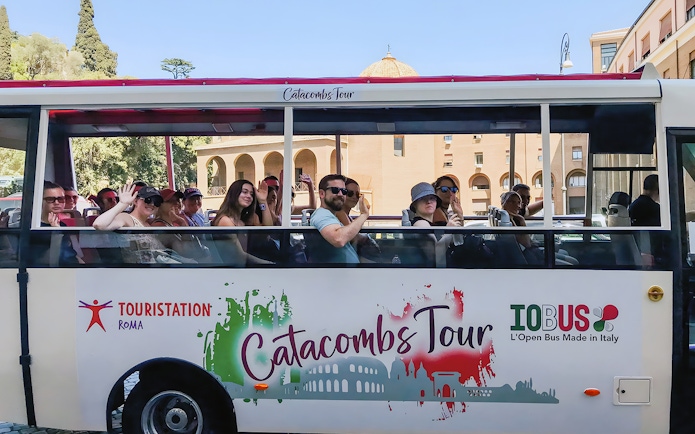 Tourists on a catacombs tour bus near Vatican Museums, Rome.