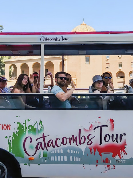 Tourists on a catacombs tour bus near Vatican Museums, Rome.