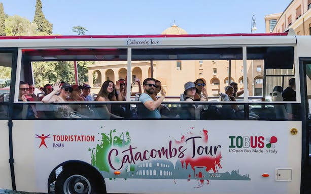 Tourists on a catacombs tour bus near Vatican Museums, Rome.