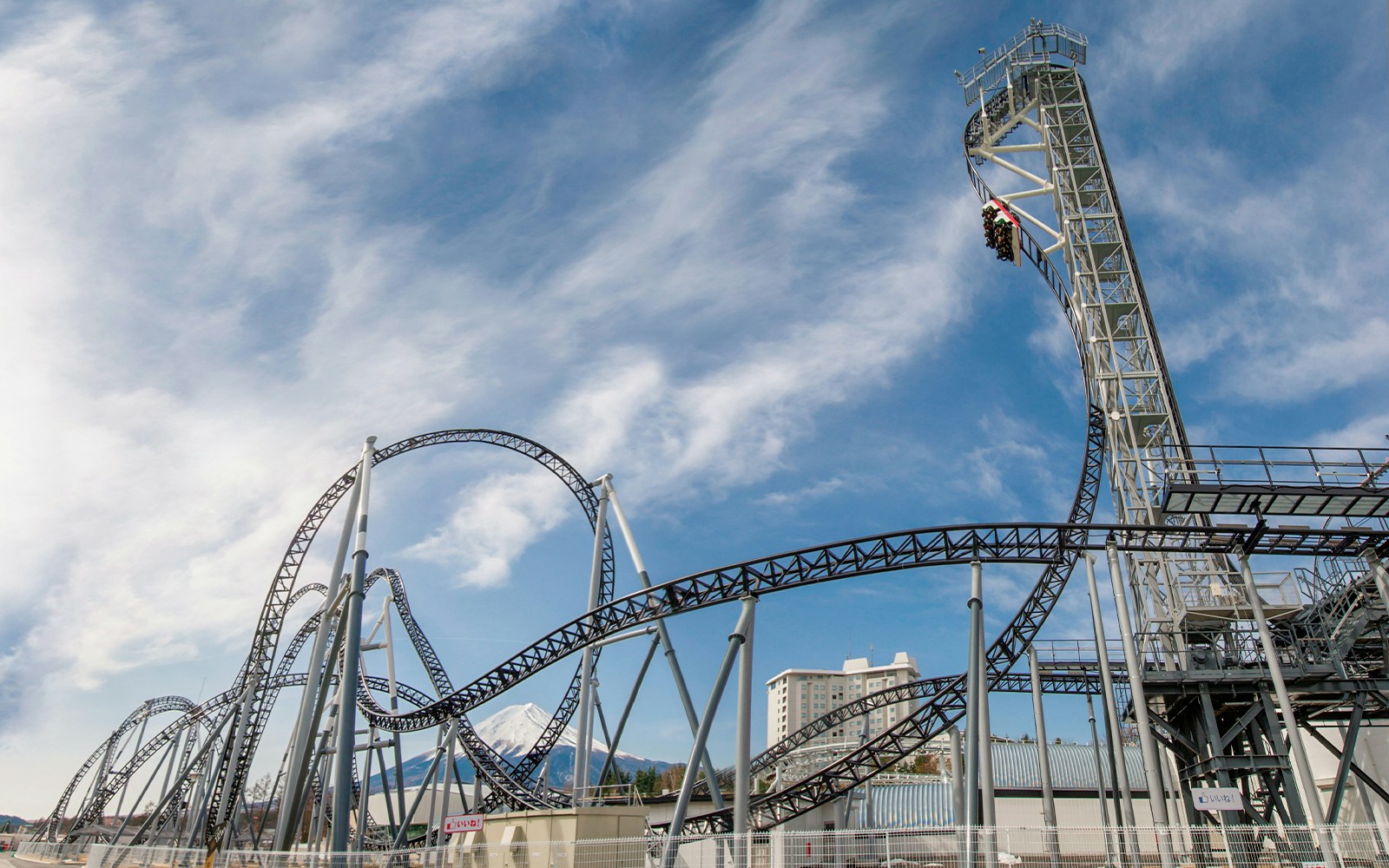 Roller coaster at Fuji-Q Highland with Mount Fuji in the background.