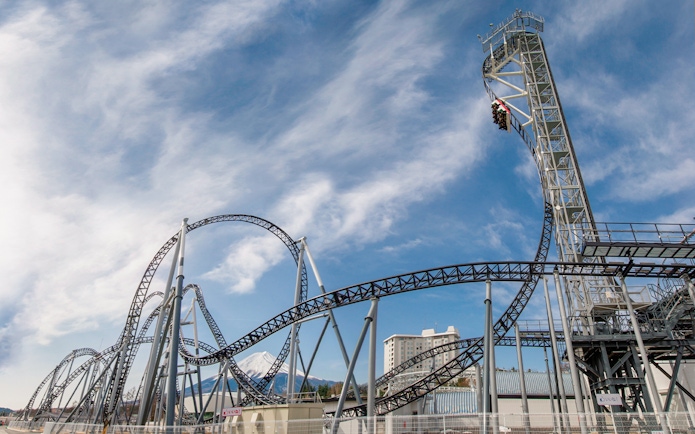 Roller coaster at Fuji-Q Highland with Mount Fuji in the background.