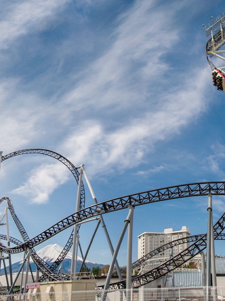 Roller coaster at Fuji-Q Highland with Mount Fuji in the background.