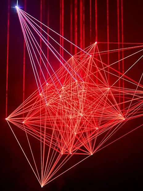 Red laser light installation at Light Art Museum exhibit.