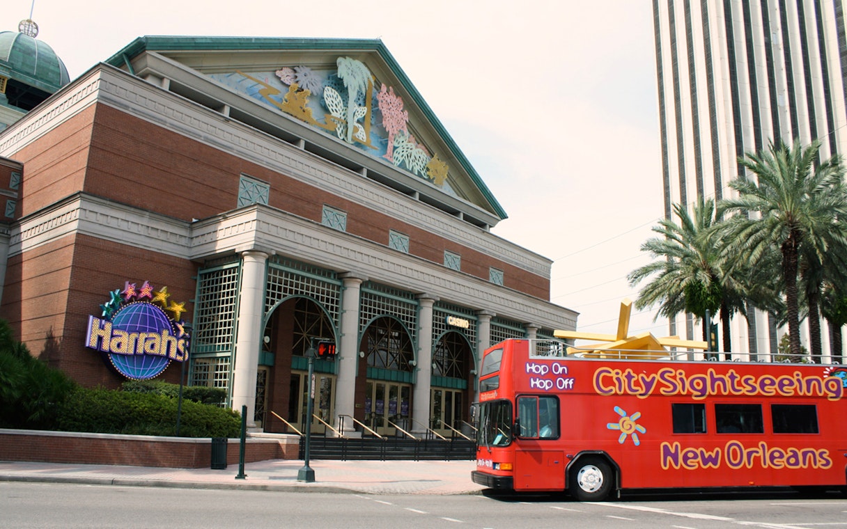 Red City Sightseeing bus in front of Harrah's Casino, New Orleans.